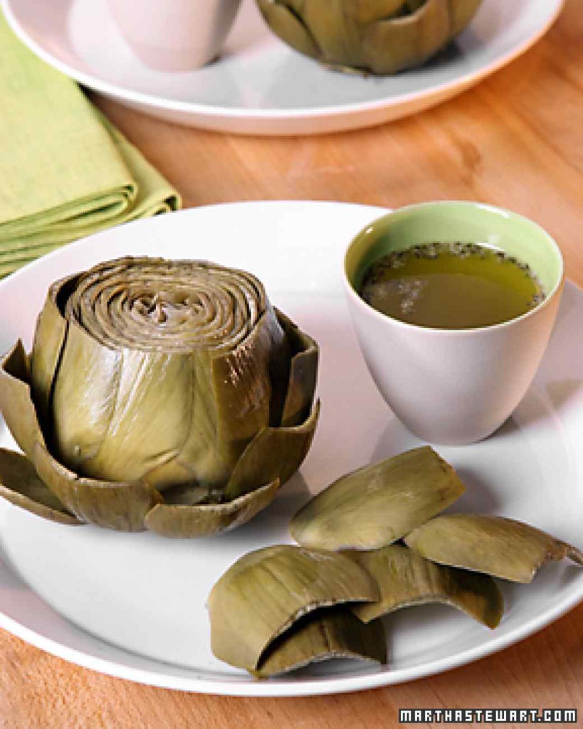 image of a steamed artichoke on a plate from Martha Stewart dot com