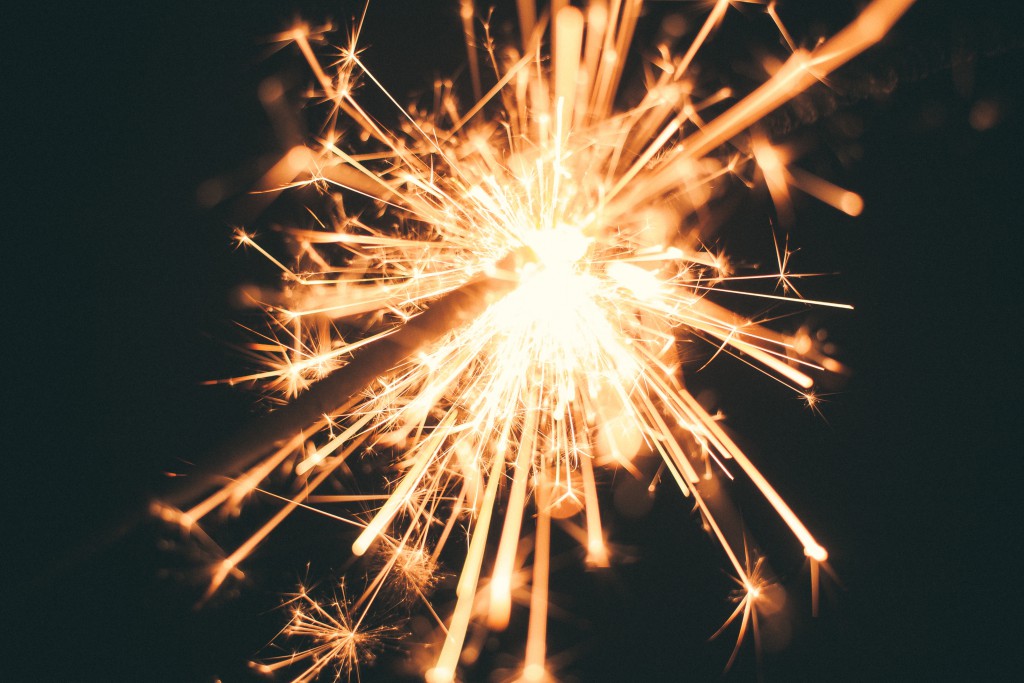 a sparkler lights up the night