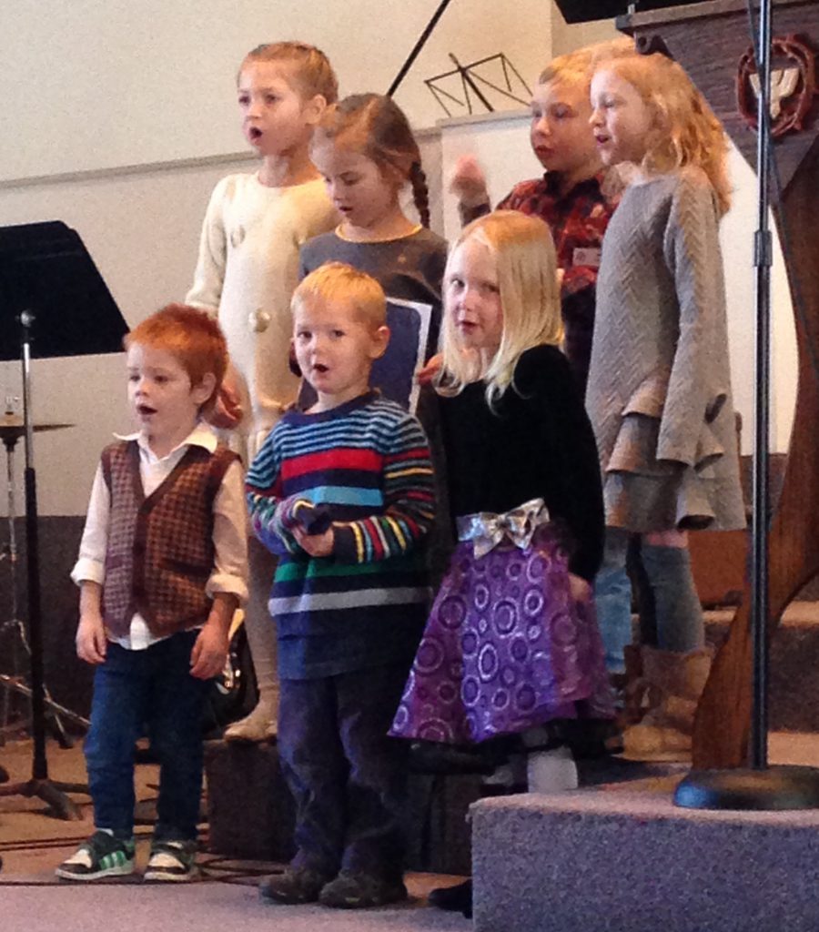 Seven kids, ages 3-6 sing in a choir.