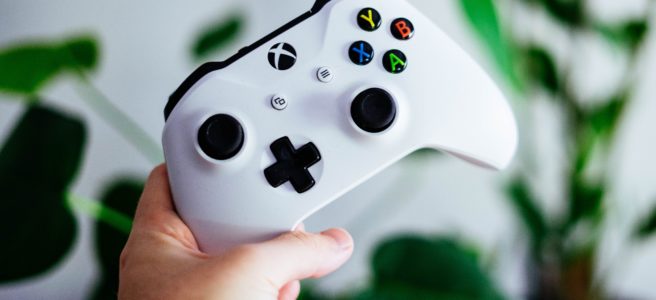 An image of the person holding an xbox one controller.